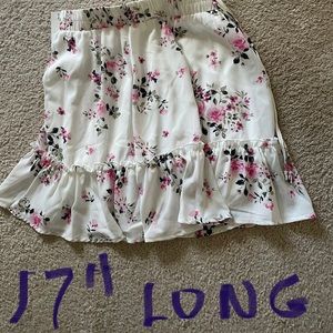 Skirt. Pretty skirt. Fully lined. White w/flowers. 17” long with elastic waist